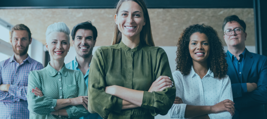 3 men and 3 woman smiling and folding arms while facing the camera
